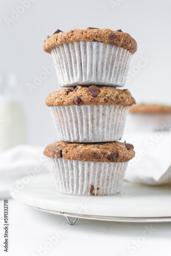 Homemade chocolate chip muffins with selective focus, bakery style chocolate chip muffins with white liners