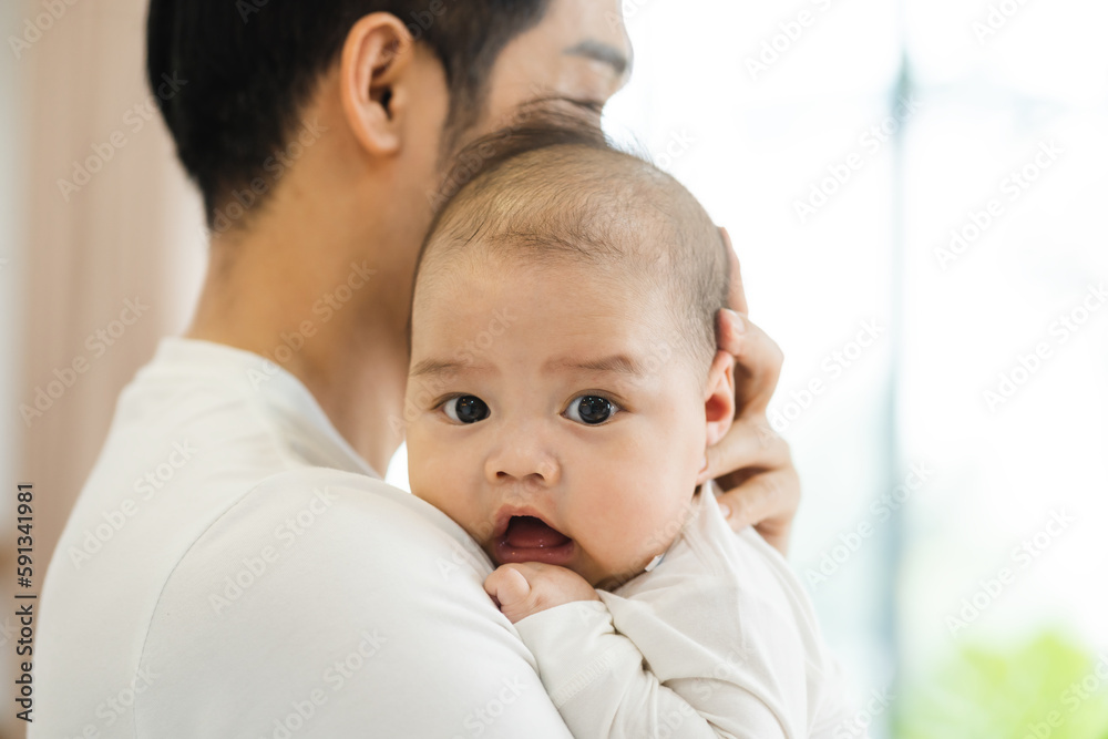 image of asian father and son at home image of asian father and son at home