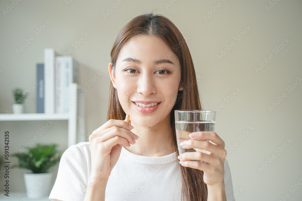 close up person pouring multivitamin capsules to her hands close up person pouring multivitamin capsules to her hands