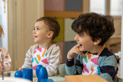 Kids playing in montessori kindergarten photo