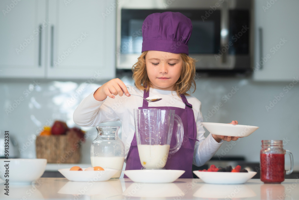 Chef kid preparing tasty food at kitchen. Chef kid cook baking at home kitchen. Chef kid preparing tasty food at kitchen. Chef kid cook baking at home kitchen.