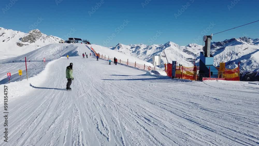 Man snowboarder in apls AD 4K Man snowboarder in apls AD 4K