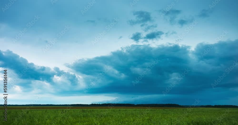 A powerfull dangerous spinning supercell storm aproaching. Wall cloud of a supercell. Climate change concept. A powerfull dangerous spinning supercell storm aproaching. Wall cloud of a supercell. Climate change concept.