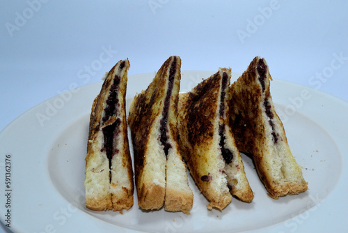 Toast on a white plate. Background is white