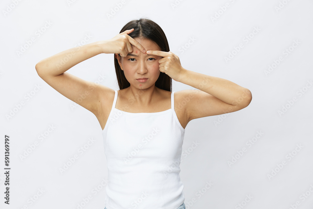 Asian woman facial skin problems, acne and inflammation, red rashes and allergies, chicken pox, sadness from rashes. Facial skin care concept for diseases and nerves Asian woman facial skin problems, acne and inflammation, red rashes and allergies, chicken pox, sadness from rashes. Facial skin care concept for diseases and nerves