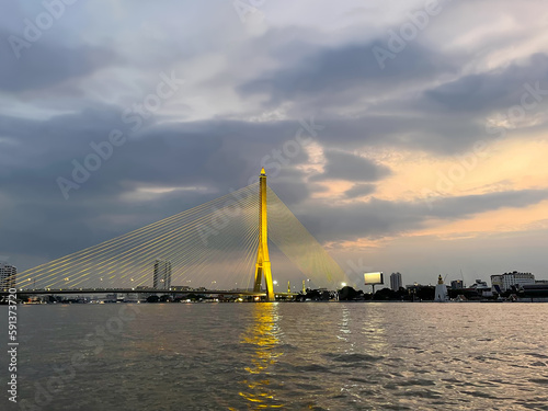 Famous Rama VIII Bridge, cable-stayed modern bridge crossing the Chao Phraya River in Bangkok city. Capital of Thailand., big metropolis of Southeast Asia. Landmark of Krung Thep Maha Nakhon at sunset