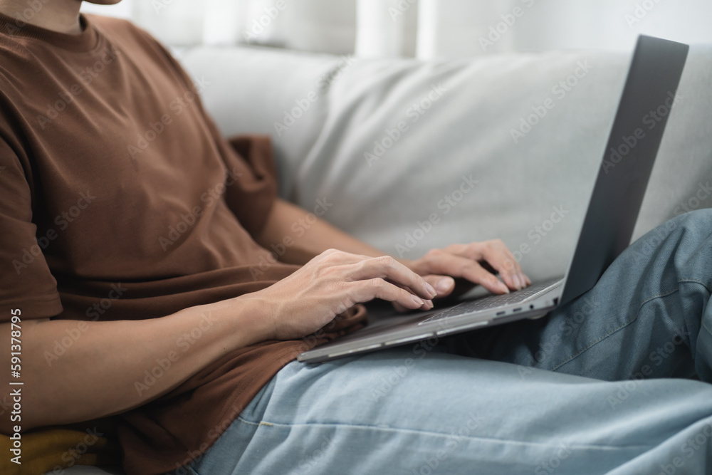 Fototapeta premium Man work from home. work online on laptop. Asian businessman working online business concept with social distancing laptop online meeting.