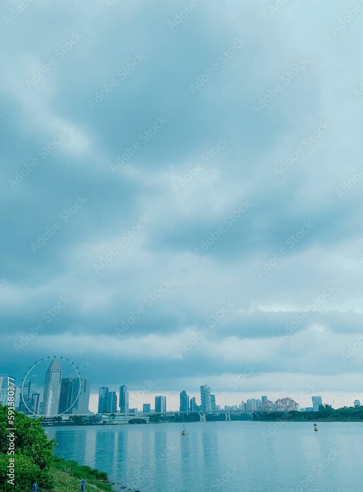 Scenic view of Singapore’s cityscape against cloudy sky. Singapore