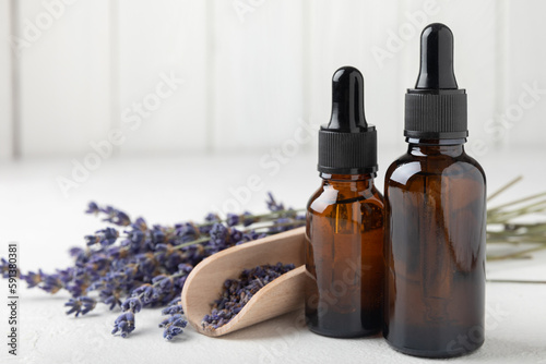 Essential oil of lavender on a white background texture.