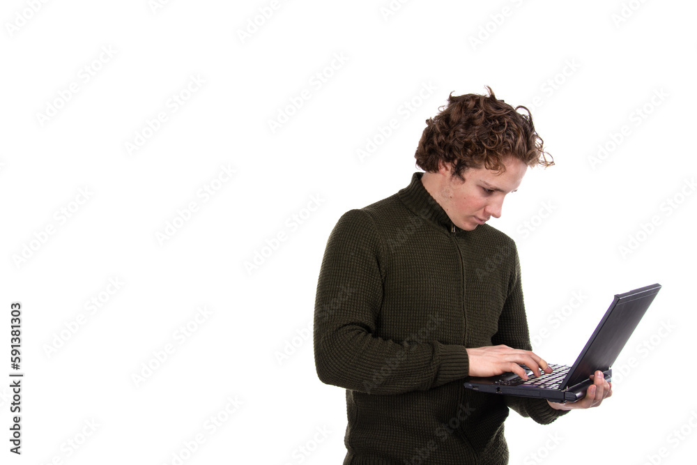 A young attractive man is working on a laptop. Early morning. White background. A young attractive man is working on a laptop. Early morning. White background.