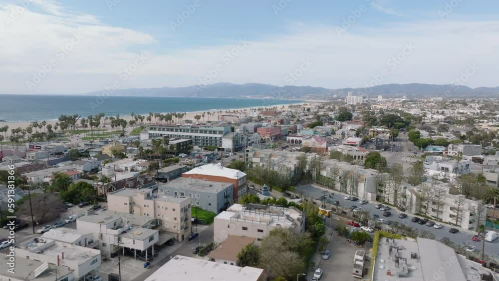 Aerial slide and pan shot of residential seaside urban borough. Large city on ocean coast. Los Angeles, California, USA Aerial slide and pan shot of residential seaside urban borough. Large city on ocean coast. Los Angeles, California, USA