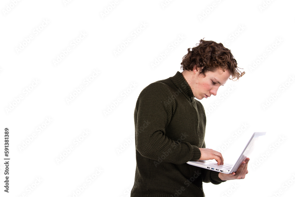 A young attractive man is working on a laptop. Early morning. White background. A young attractive man is working on a laptop. Early morning. White background.