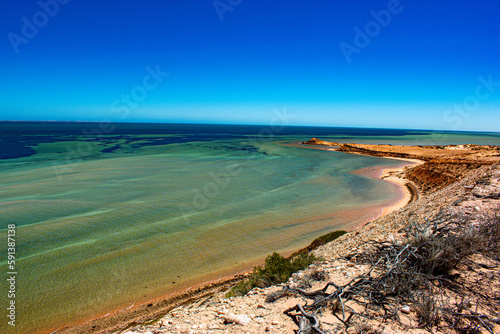Australia, Eagle Bluff is a breathtaking high cliff located in Shark Bay area. This place offers amazing views as well as a chance to spot a variety of shark species, dolphins and dugongs.