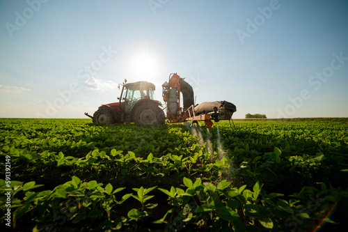 Spraying pesticides at soy bean fields