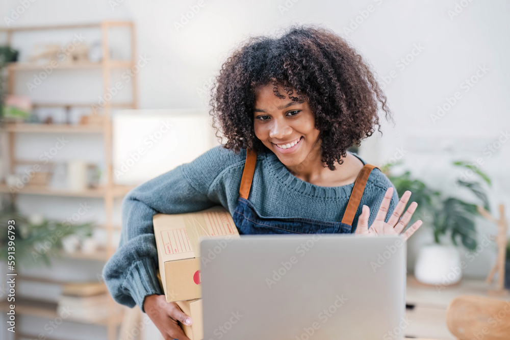 Startup small business entrepreneur SME, asian woman packing cloth in box. Portrait young Asian small business owner home office, online sell marketing delivery, SME e-commerce telemarketing concept. Startup small business entrepreneur SME, asian woman packing cloth in box. Portrait young Asian small business owner home office, online sell marketing delivery, SME e-commerce telemarketing concept.