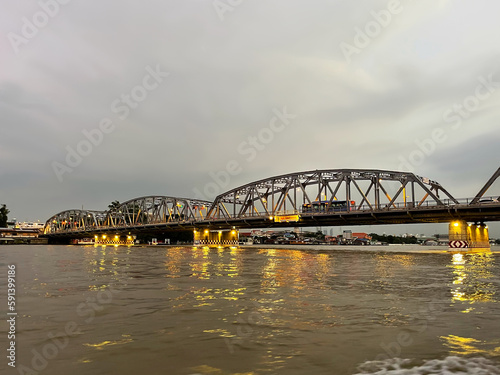 Krung Thon Bridge over Chao Phraya River. Bangkok city at sunset. Thailand. Sang Hi connecting districts Dusit and Bang Phlat, has 6 spans, consists of steel superstructure resting on concrete piers.