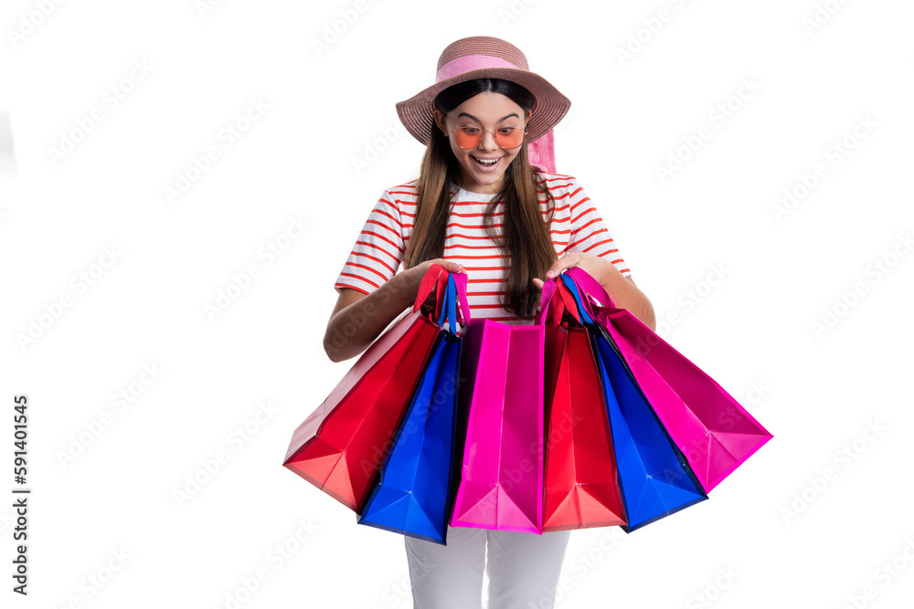 amazed teen girl at shopping sale in studio. photo of teen girl at shopping sale with bags.