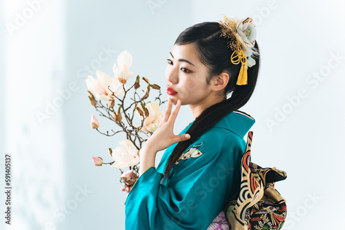 Portrait of young Asian girl wearing kimono. Japanese traditional ceremony dress.