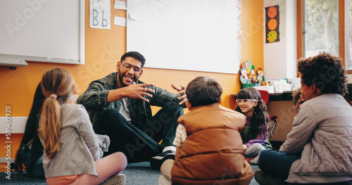 Fotografia Male educator talking to his students in a classroom