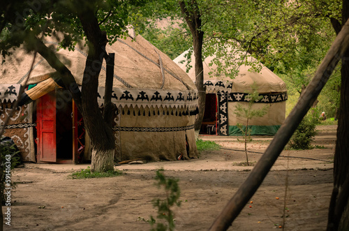 Yurts in an apricot orchard at a campsite in the Kyrgyz village of Ozgrush.