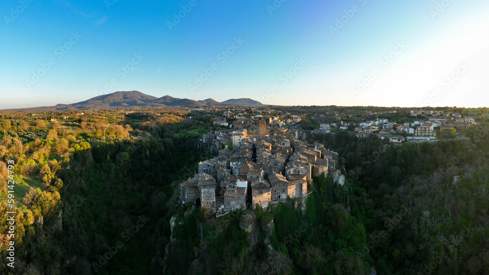 View from above, stunning panoramic view of the village of Vitorchiano at sunset. Vitorchiano is a medieval Italian village in Viterbo Province, Lazio, Italy.