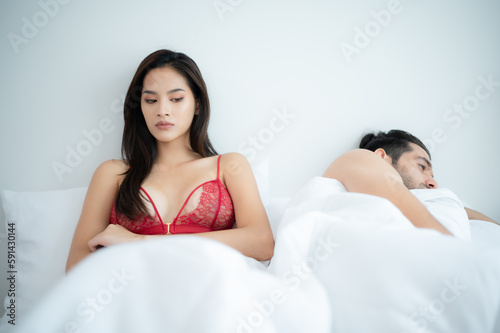 Couple in bed unhappy in sex It's a relationship problem in a married life. The concept of erectile dysfunction, causes of divorce