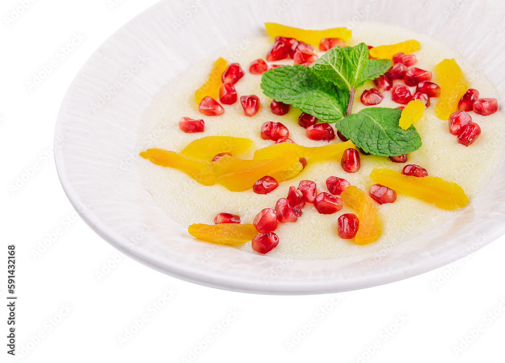 Plate of oatmeal with porridge , dried apricots and pomegranates Plate of oatmeal with porridge , dried apricots and pomegranates