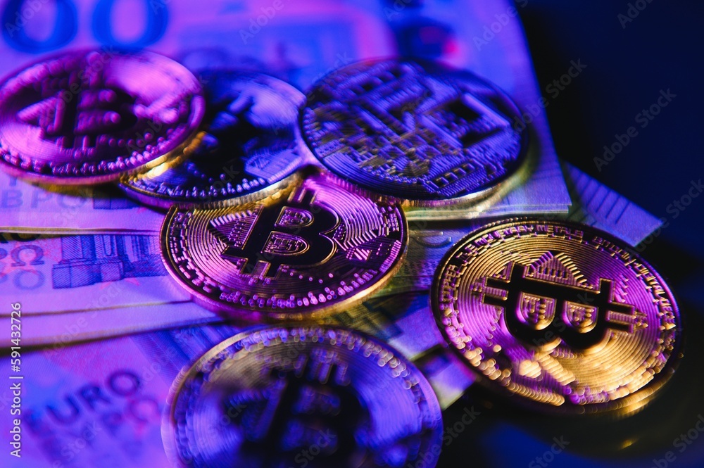 Golden bitcoin over Euro money. Bitcoin cryptocurrency. Crypto currency concept. Bitcoin with euro bills. Bitcoins stacked on euro banknotes Golden bitcoin over Euro money. Bitcoin cryptocurrency. Crypto currency concept. Bitcoin with euro bills. Bitcoins stacked on euro banknotes
