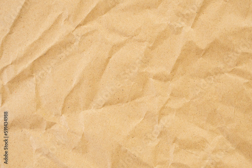Abstract brown crumpled creased recycle paper texture background