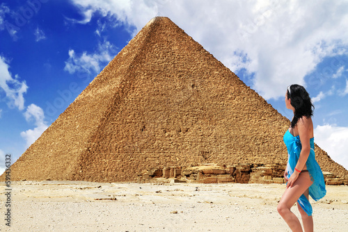 Beautiful woman on vacation at the Great Pyramid in Egypt.
