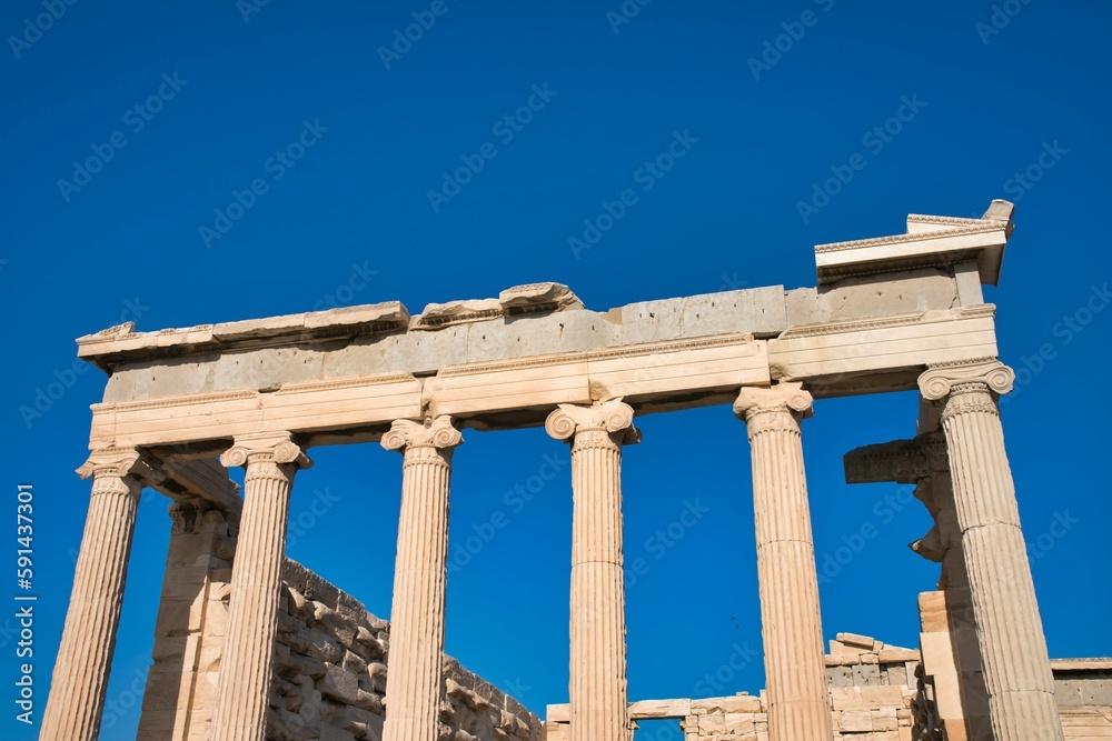 Low angle shot of the Parthenon against a blue sky in Athens, Greece on a sunny day