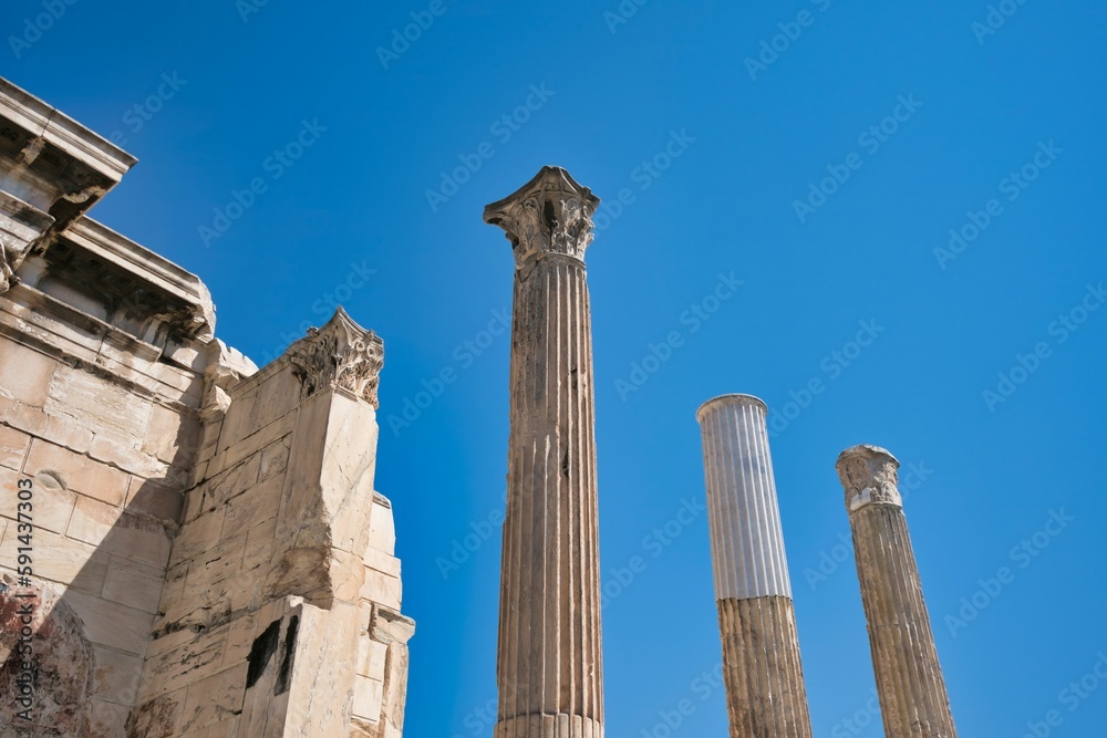 Low angle of the Temple of Olympian Zeus against a blue sky in Athens, Greece on a sunny day