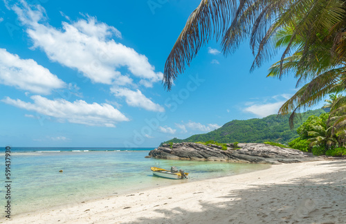 Wooden boat in Anse Forbans beach photo