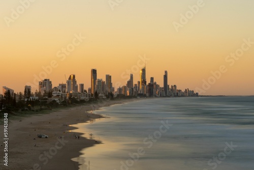 Sunset view of the Gold Coast and skyline in the background, Australia © Peter Watson/Wirestock Creators