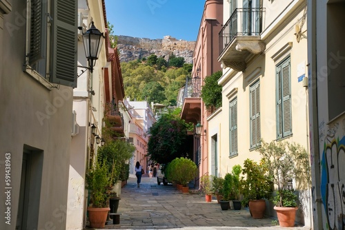 Fototapeta Naklejka Na Ścianę i Meble -  Scenic view of a narrow alley in Athens, Greece, surrounded by residential buildings