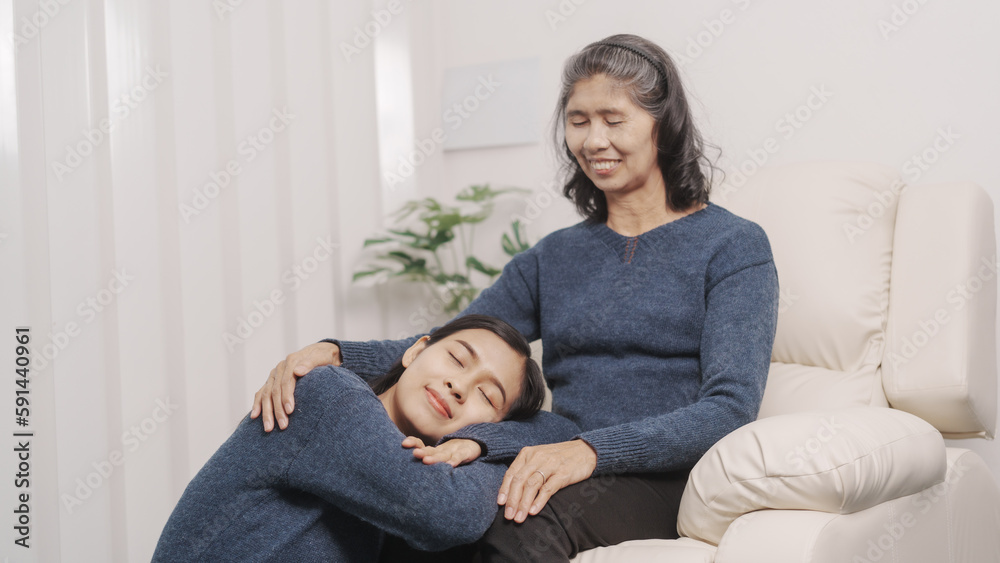 Mother's day concept, young adult female daughter congratulate excited asian elderly mother at sofa with birthday anniversary, two generations family photo, real people. Mother's day concept, young adult female daughter congratulate excited asian elderly mother at sofa with birthday anniversary, two generations family photo, real people.
