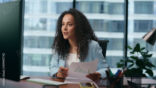 Woman conducting online meeting in office closeup. Girl talking on video chat.