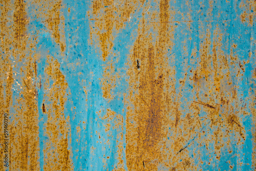 Old cracked paint in craquelure on a rusty metal surfaceGrunge rusted metal texture. Rusty corrosion and oxidized background. Worn metallic iron rusty metal background. 