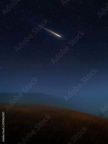 Falling meteorite. Glowing meteor in the night sky over the hills. Night landscape with stars and comet.