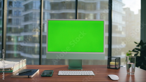 Computer monitor mockup placed desk closeup. Green screen pc modern workplace
