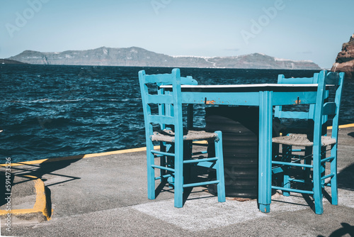 Empty table and chairs, Old Port Fira, Santorini