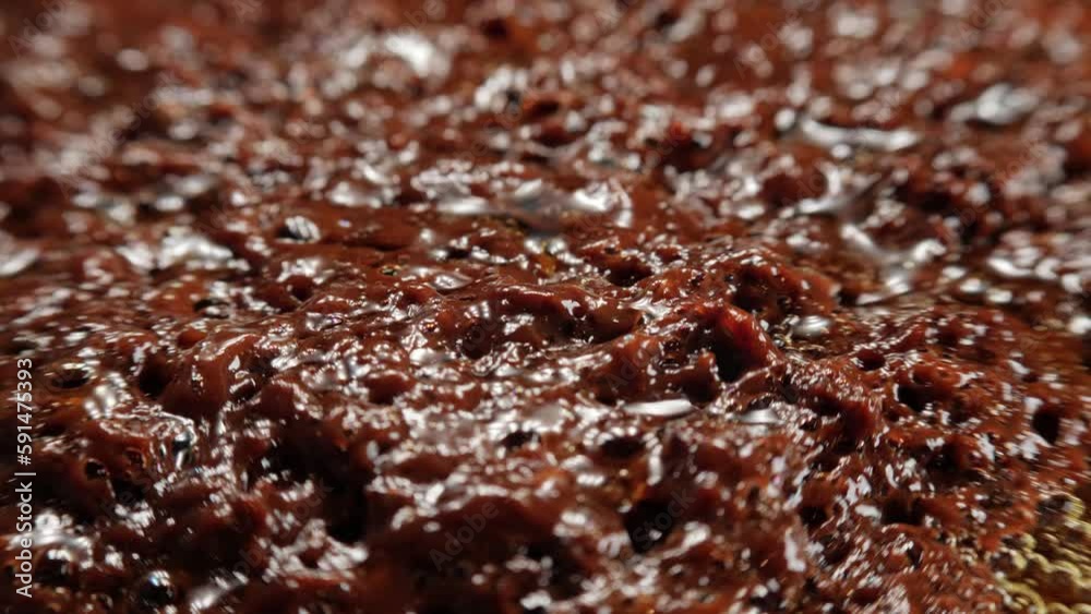 Boiling substance, macro shot. Overcooked caramel. Boiling substance, macro shot. Overcooked caramel.