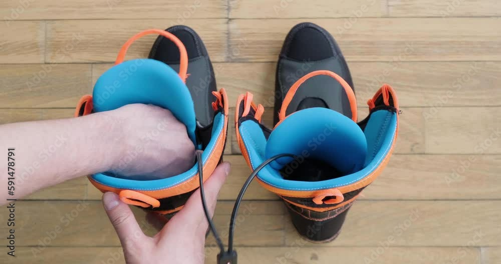 Stockvideon Electric boot dryers inside ski boot liners, used to dry