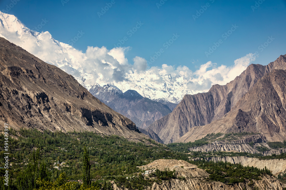 Breathtaking beauty of Hunza Valley and the majestic Karakorum Mountains, where the crystal-clear Hunza River winds its way through stunning landscapes.