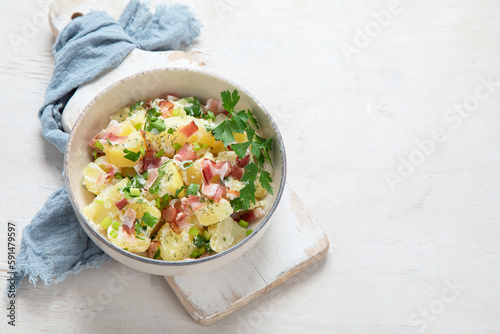 Kartoffelsalat - traditional German potato salad. Potato salad with bacon.