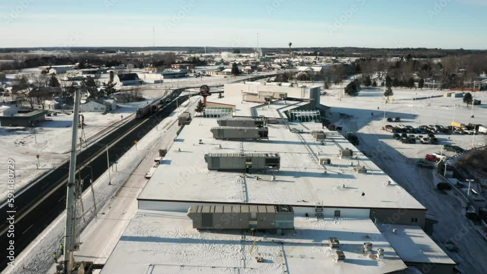 Aerial, newly installed industrial HVAC system units on building roof top Aerial, newly installed industrial HVAC system units on building roof top