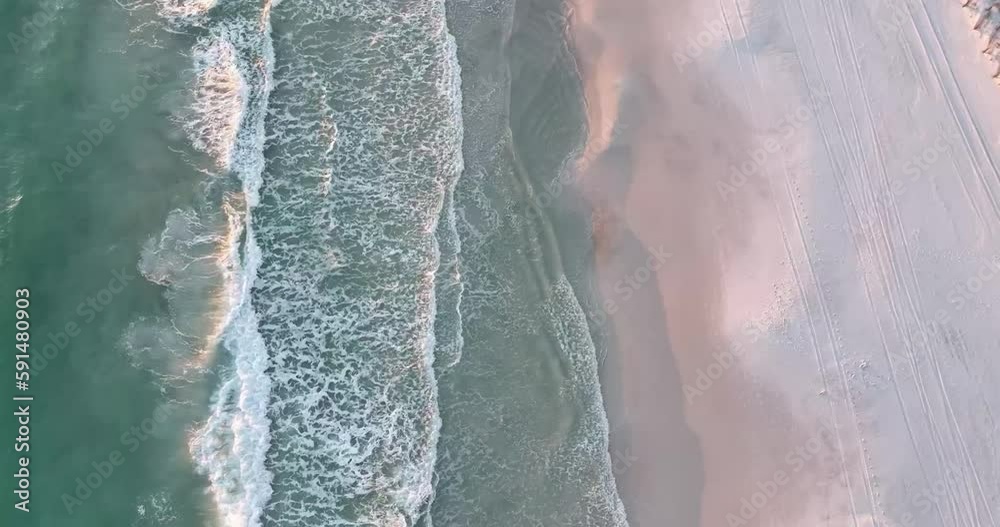 Waves crashing from above during sunset Waves crashing from above during sunset