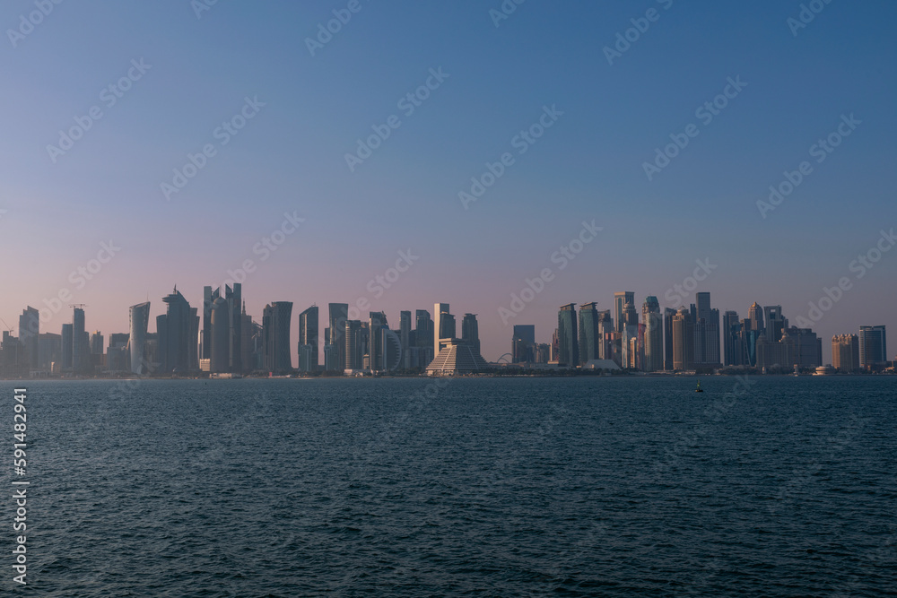 Doha, Qatar - December 12 2022: A view of the Doha Corniche and the towers, one of the most beautiful places in Qatar. A picture taken at night