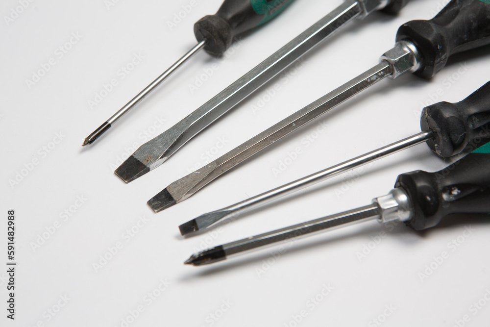 Set of tools for repair in a case on a white background. Assorted work or construction tools. Wrenches, Pliers, screwdriver. Top view Set of tools for repair in a case on a white background. Assorted work or construction tools. Wrenches, Pliers, screwdriver. Top view
