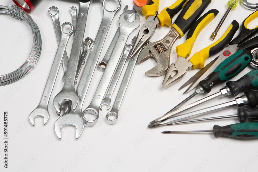 Set of tools for repair in a case on a white background. Assorted work or construction tools. Wrenches, Pliers, screwdriver. Top view Set of tools for repair in a case on a white background. Assorted work or construction tools. Wrenches, Pliers, screwdriver. Top view